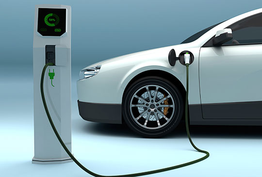 Best Electric Car Insurance UK 2025 – Electric car charging at station